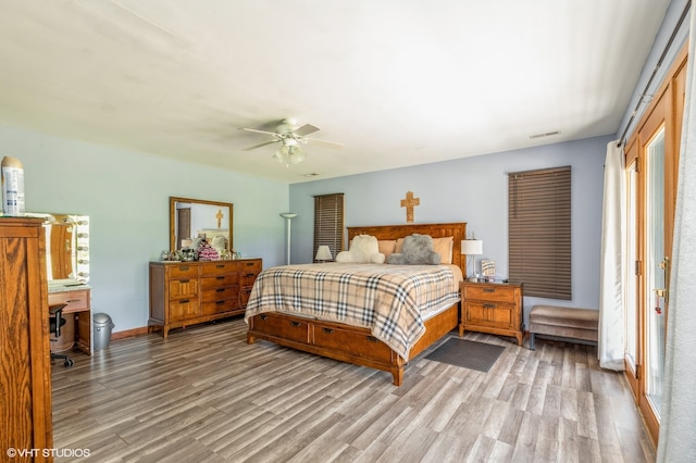 bedroom featuring light hardwood / wood-style floors and ceiling fan