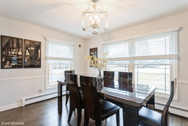 dining area with baseboard heating, a notable chandelier, dark hardwood / wood-style floors, and plenty of natural light