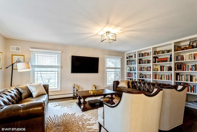 6430 Thurlow St, Willowbrook, IL 60527 - living room featuring healthy amount of natural light, wood finished floors, and a baseboard radiator