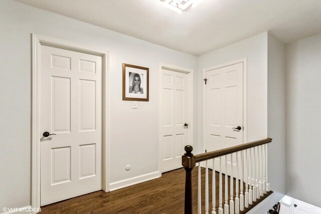 6430 Thurlow St, Willowbrook, IL 60527 - hallway featuring dark wood-type flooring, baseboards, and an upstairs landing