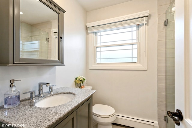 bathroom with vanity, a baseboard radiator, a shower with shower door, and toilet