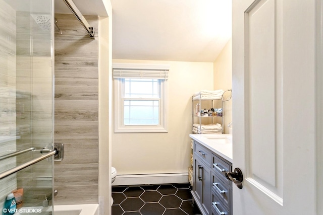 6430 Thurlow St, Willowbrook, IL 60527 - bathroom featuring a baseboard heating unit, vanity, tile patterned floors, a stall shower, and toilet