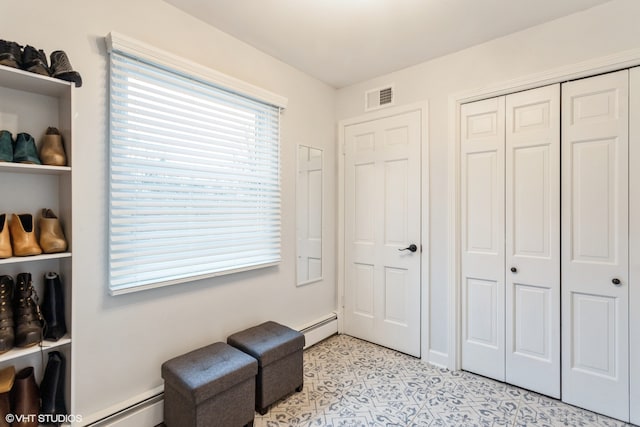 living area featuring a baseboard radiator