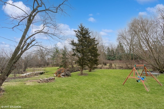 6430 Thurlow St, Willowbrook, IL 60527 - view of grassy yard featuring a playground