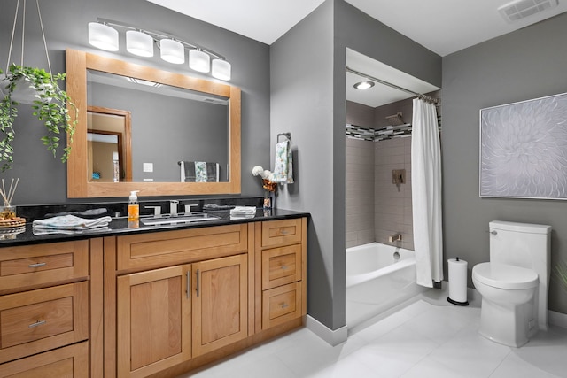 full bathroom with toilet, shower / bath combo, vanity, and tile patterned flooring