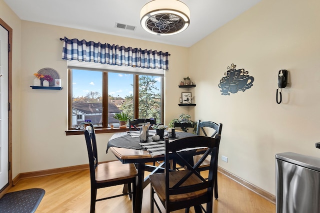 dining space featuring light hardwood / wood-style flooring