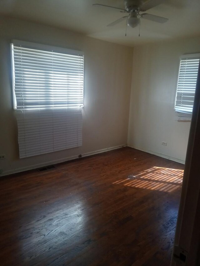 bedroom with dark hardwood / wood-style flooring