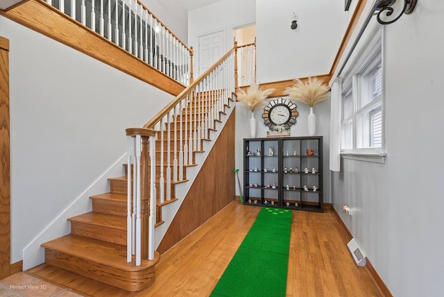 stairs with hardwood / wood-style flooring