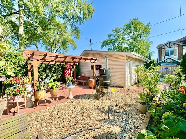 rear view of house featuring a pergola and a patio area