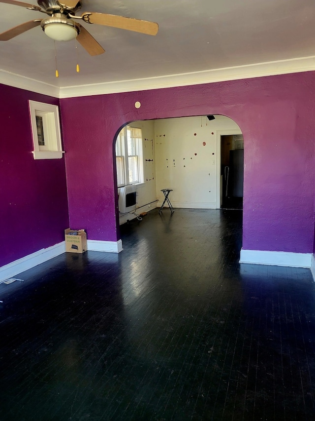 spare room featuring ceiling fan, crown molding, and hardwood / wood-style floors