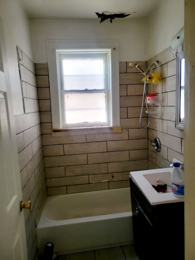 bathroom with vanity and shower / tub combination