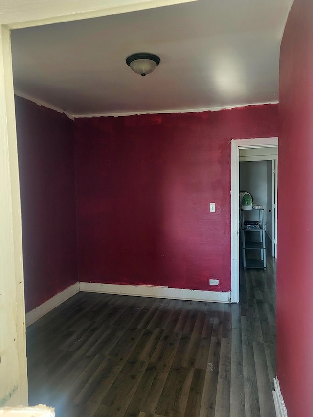 spare room featuring dark hardwood / wood-style floors