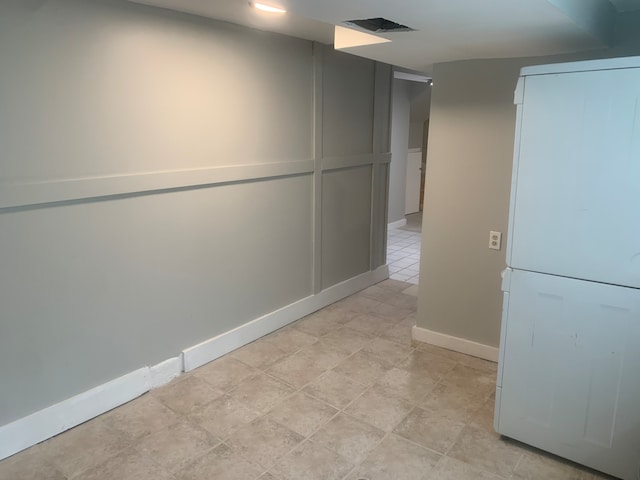 corridor featuring light tile patterned floors