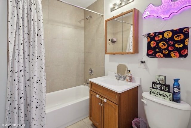 full bathroom featuring vanity, toilet, tile patterned floors, and shower / bath combo