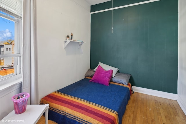 bedroom with wood-type flooring