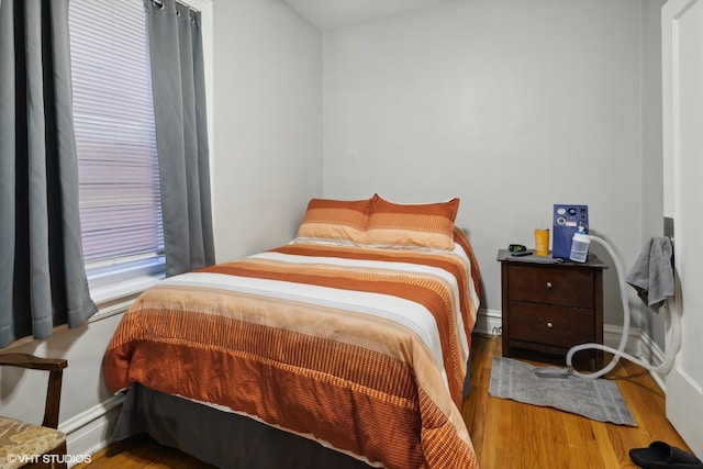 bedroom with light hardwood / wood-style floors