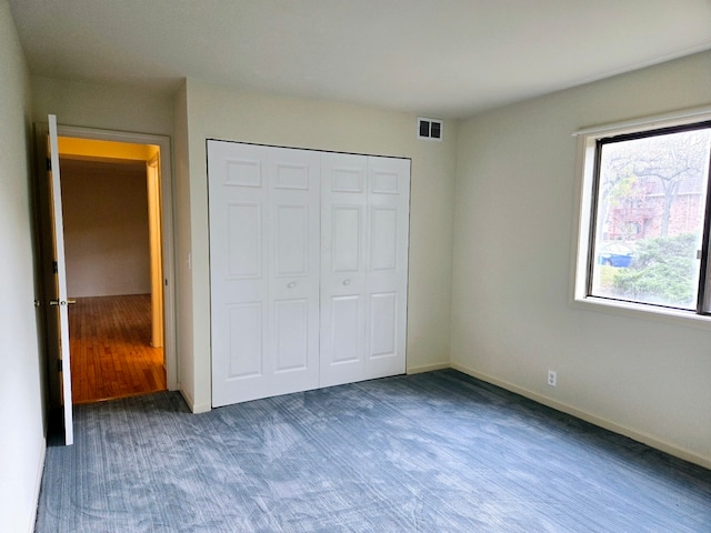 unfurnished bedroom featuring a closet