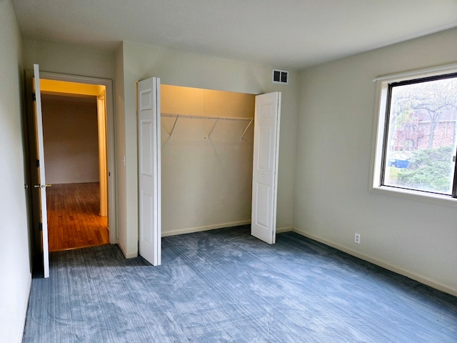 unfurnished bedroom with a closet