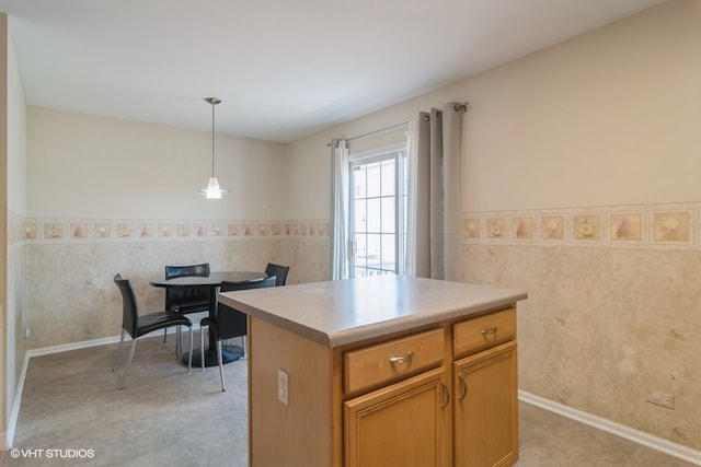 kitchen featuring a center island and hanging light fixtures