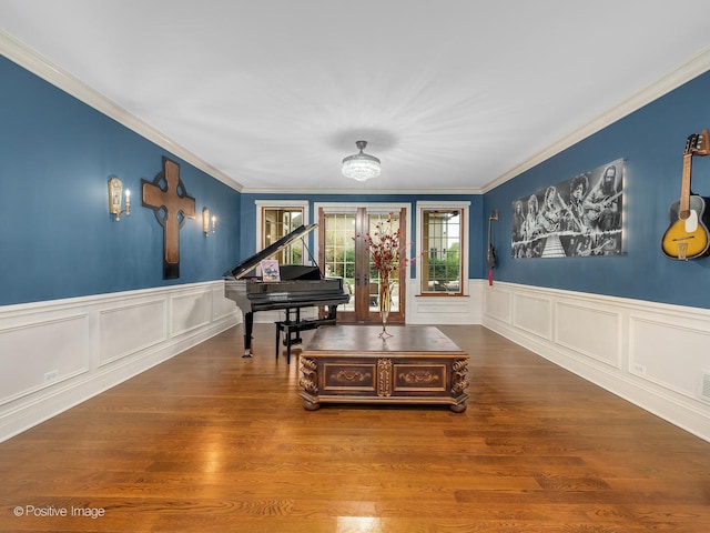 misc room featuring french doors, crown molding, and hardwood / wood-style floors