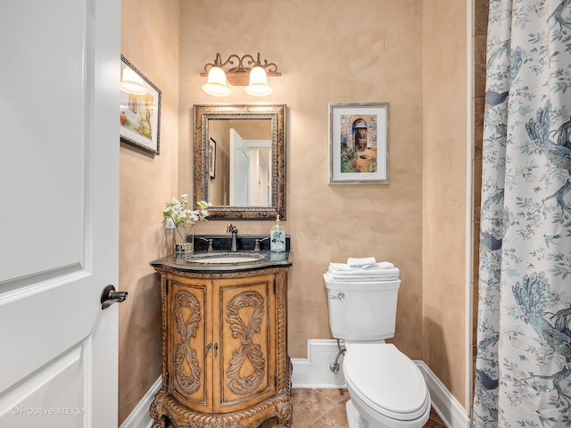 bathroom featuring toilet, curtained shower, vanity, and tile patterned floors