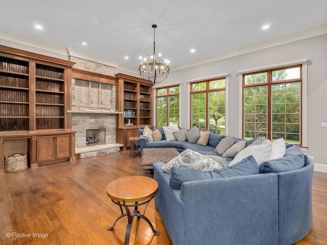 living room featuring ornamental molding, hardwood / wood-style floors, and a stone fireplace