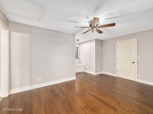 unfurnished room featuring ceiling fan and dark hardwood / wood-style flooring