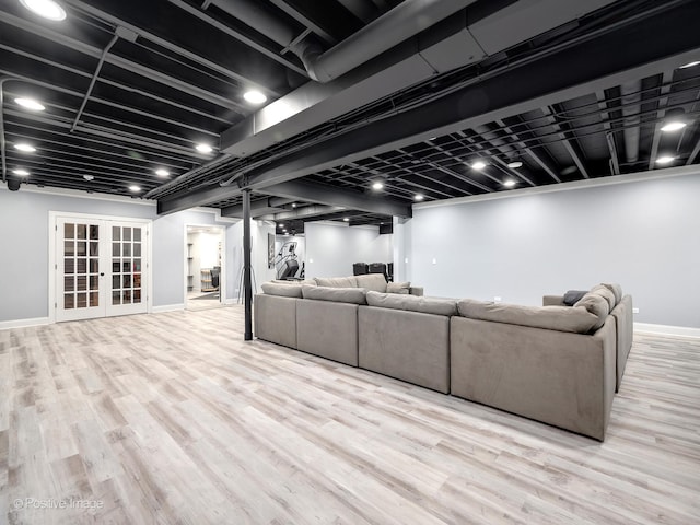 living room featuring french doors and light hardwood / wood-style flooring