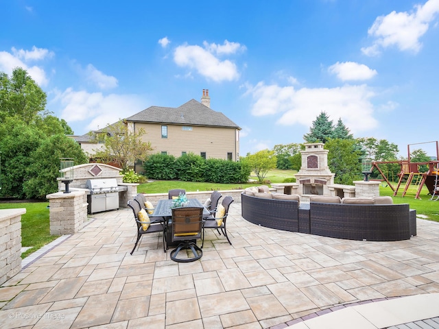 view of patio / terrace featuring grilling area and exterior fireplace