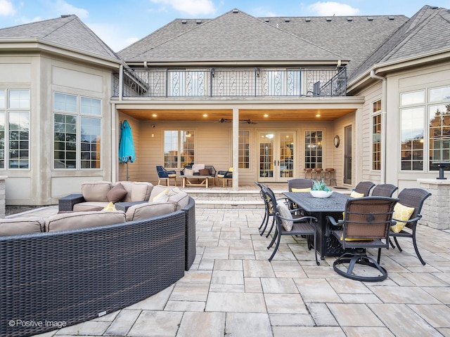 view of patio with a balcony, an outdoor hangout area, and french doors