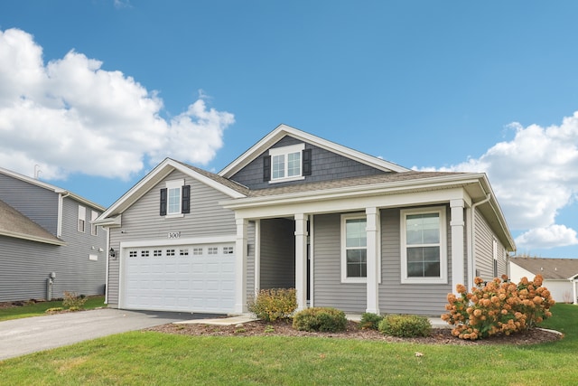 view of front facade featuring a front yard and a garage