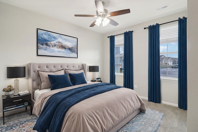 carpeted bedroom with ceiling fan