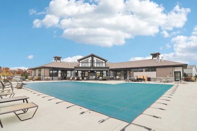 view of swimming pool with a patio