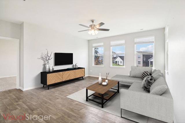 living room with hardwood / wood-style floors and ceiling fan