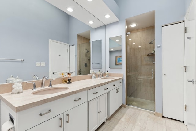 bathroom featuring vanity and a shower with shower door