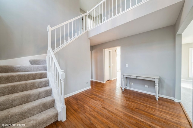 stairs with wood-type flooring