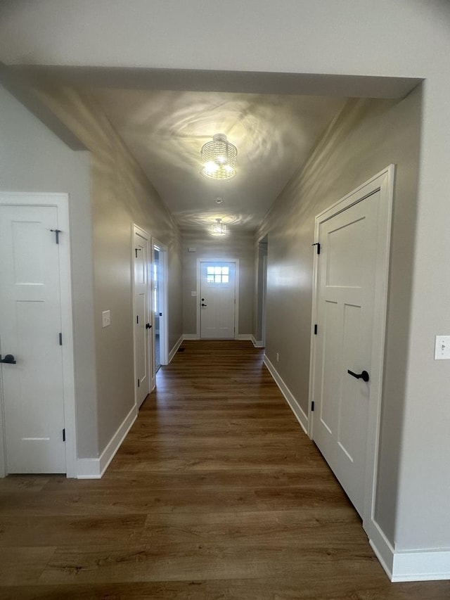 hall with dark hardwood / wood-style floors