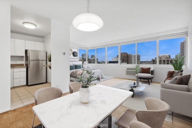 dining space with light parquet flooring