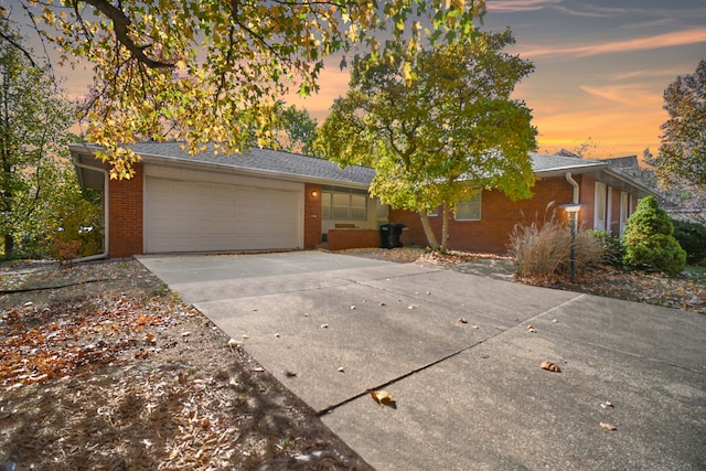 ranch-style house featuring a garage