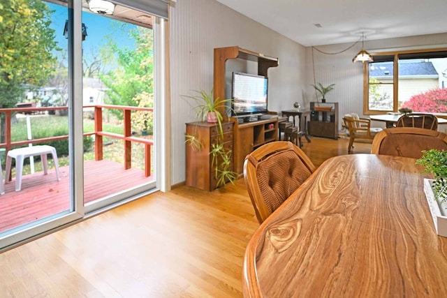 dining space with light wood-type flooring