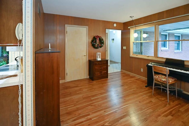 office with hardwood / wood-style flooring and wooden walls