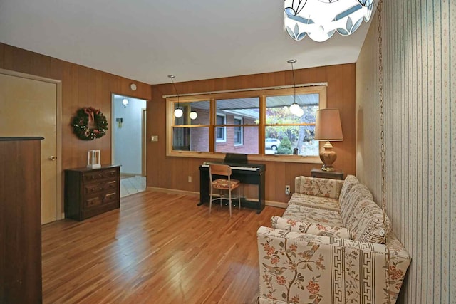 office area with wood walls and hardwood / wood-style flooring