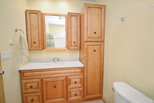 bathroom with vanity and toilet