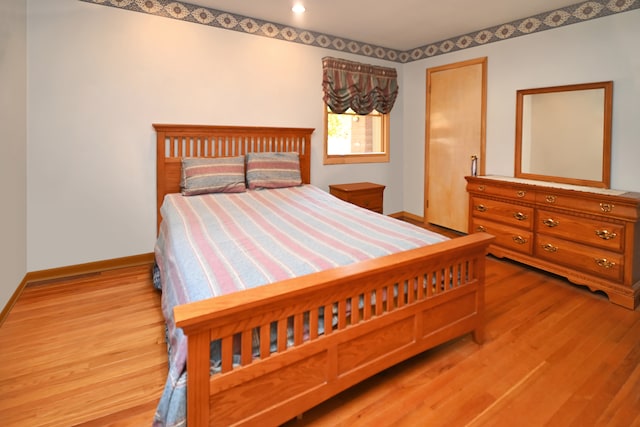 bedroom with light wood-type flooring