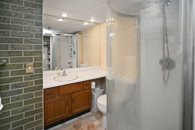 bathroom with vanity, toilet, and an enclosed shower