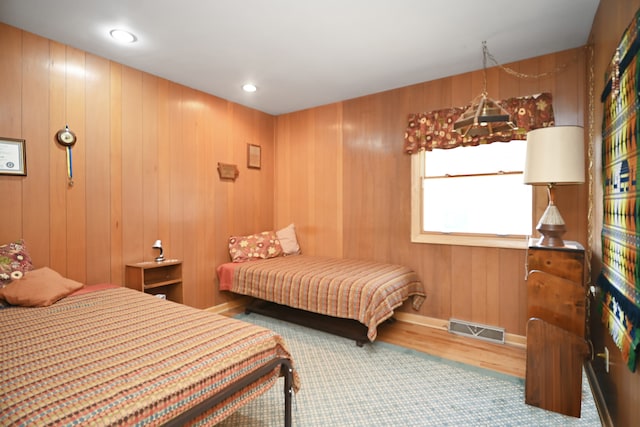 bedroom with wooden walls