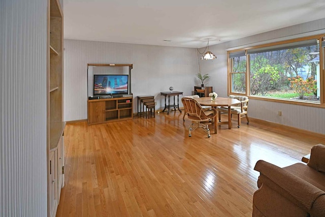 dining area featuring light wood-type flooring