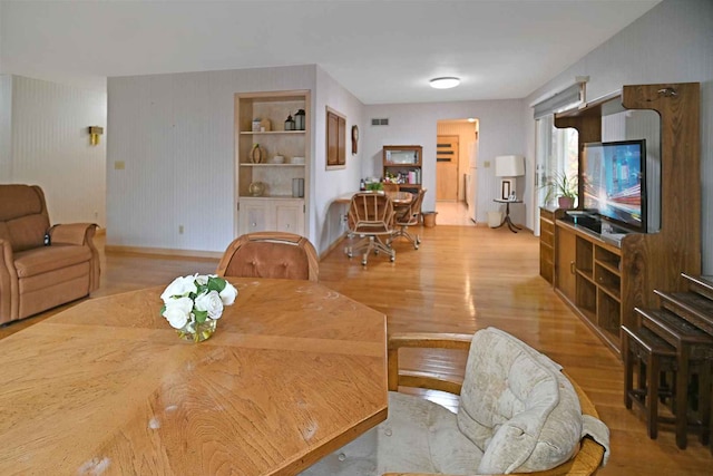 dining space with light wood-type flooring