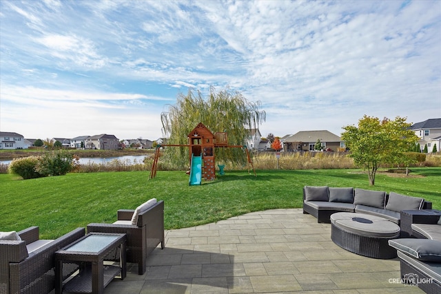 view of patio / terrace with an outdoor hangout area, a water view, and a playground