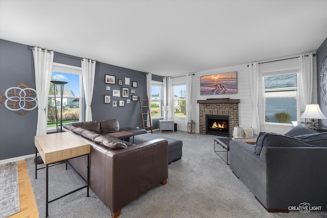 living room with carpet, plenty of natural light, and a fireplace